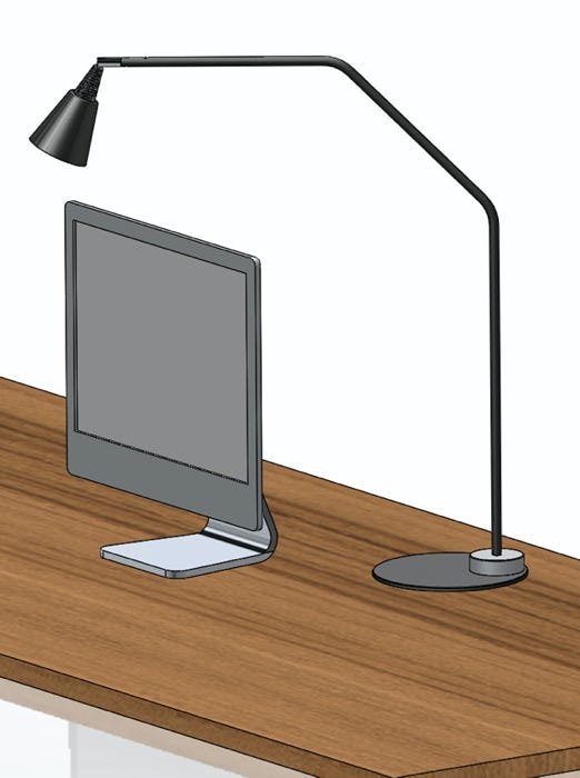 Imac on table with cone desklamp